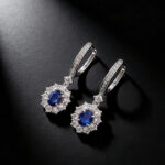 Halo setting oval cut lab grown sapphire hoop earrings