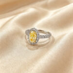 Halo setting oval cut lab grown yellow diamond engagement ring