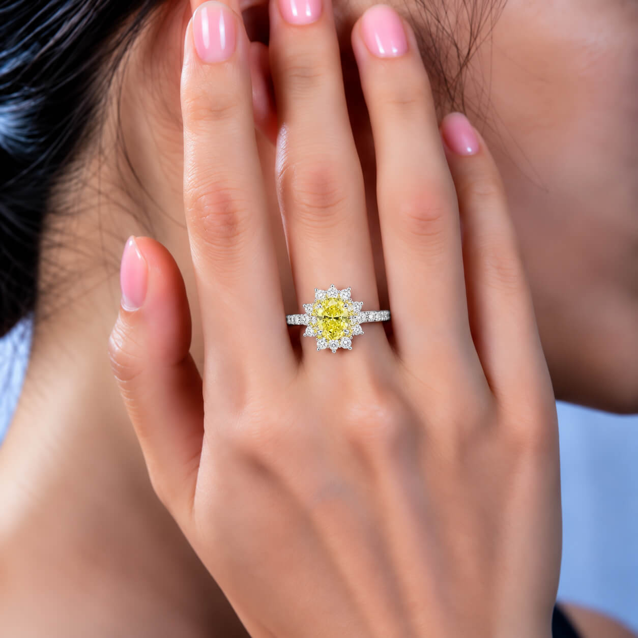 Halo setting oval cut lab grown yellow diamond engagement ring