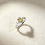 Halo setting oval cut lab grown yellow diamond engagement ring
