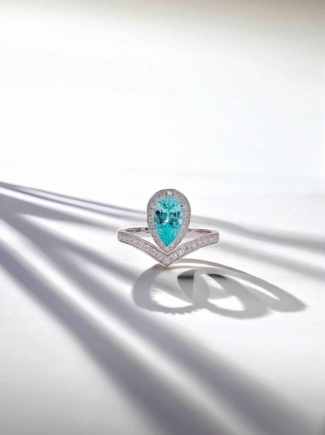 Halo setting pear cut lab grown Paraiba engagement ring 01 Halo setting pear cut lab grown Paraiba engagement ring 01