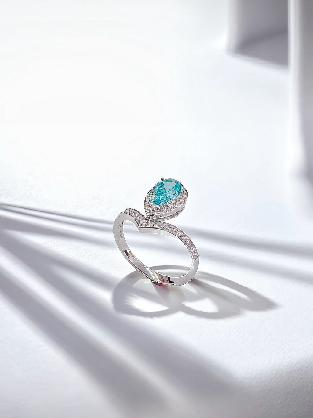 Halo setting pear cut lab grown Paraiba engagement ring 01 Halo setting pear cut lab grown Paraiba engagement ring 01