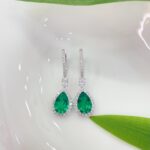 Halo setting pear cut lab grown emerald hoop earrings