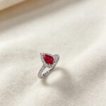 Halo setting pear cut lab grown ruby engagement ring