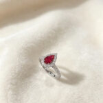 Halo setting pear cut lab grown ruby engagement ring