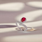 Halo setting pear cut lab grown ruby engagement ring