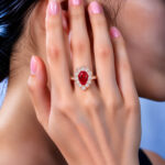 Halo setting pear cut lab grown ruby engagement ring