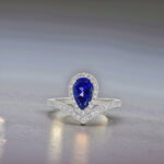 Halo setting pear cut lab grown sapphire engagement ring 04