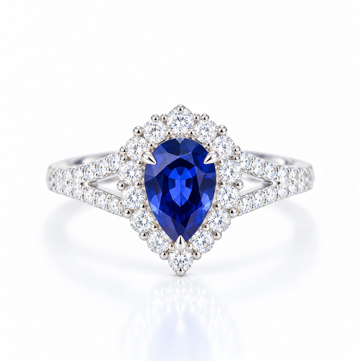 Halo setting pear cut lab grown sapphire engagement ring 02 Halo setting pear cut lab grown sapphire engagement ring 02