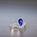 Halo setting pear cut lab grown sapphire engagement ring 04