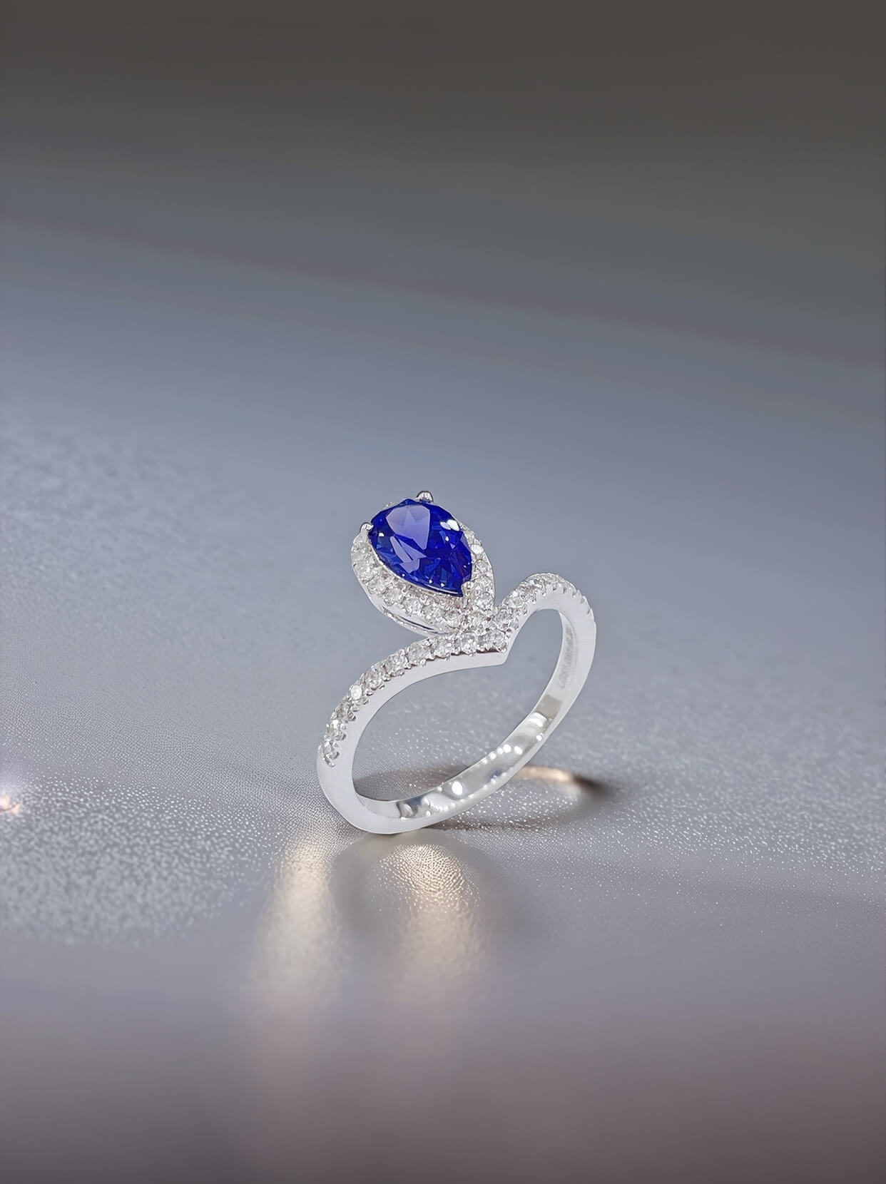 Halo setting pear cut lab grown sapphire engagement ring 04