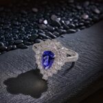 Halo setting pear cut lab grown sapphire engagement ring 3 Halo setting pear cut lab grown sapphire engagement ring 01