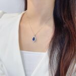 Halo setting pear cut lab grown sapphire pendant necklace 5 Halo setting pear cut lab grown sapphire pendant necklace 01