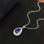 Halo setting pear cut lab grown sapphire pendant necklace 3 Halo setting pear cut lab grown sapphire pendant necklace 01