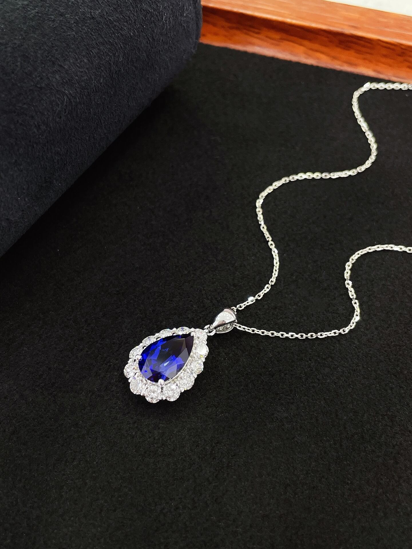 Halo setting pear cut lab grown sapphire pendant necklace 01 Halo setting pear cut lab grown sapphire pendant necklace 01