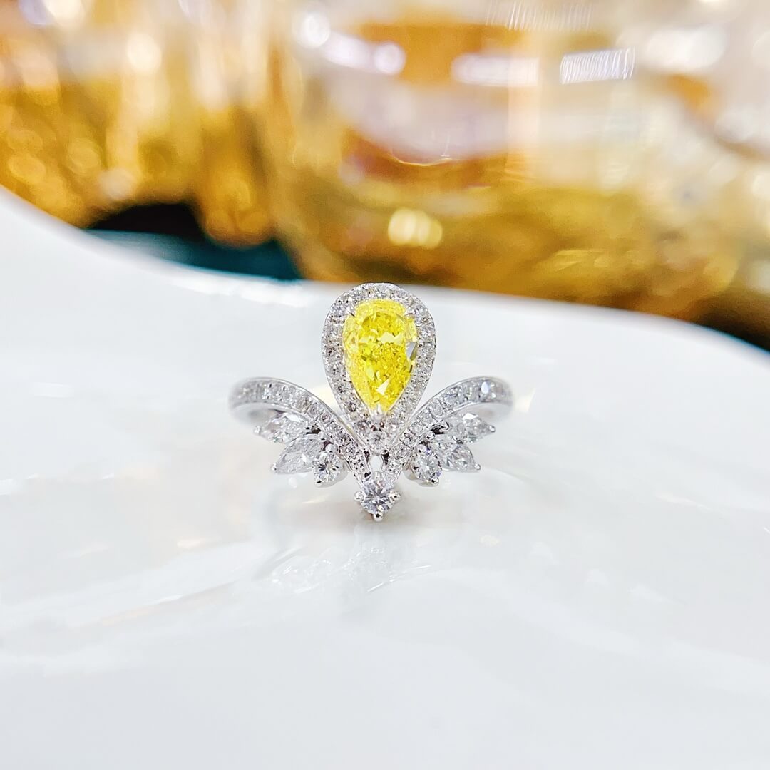 Halo setting pear cut lab grown yellow diamond engagement ring
