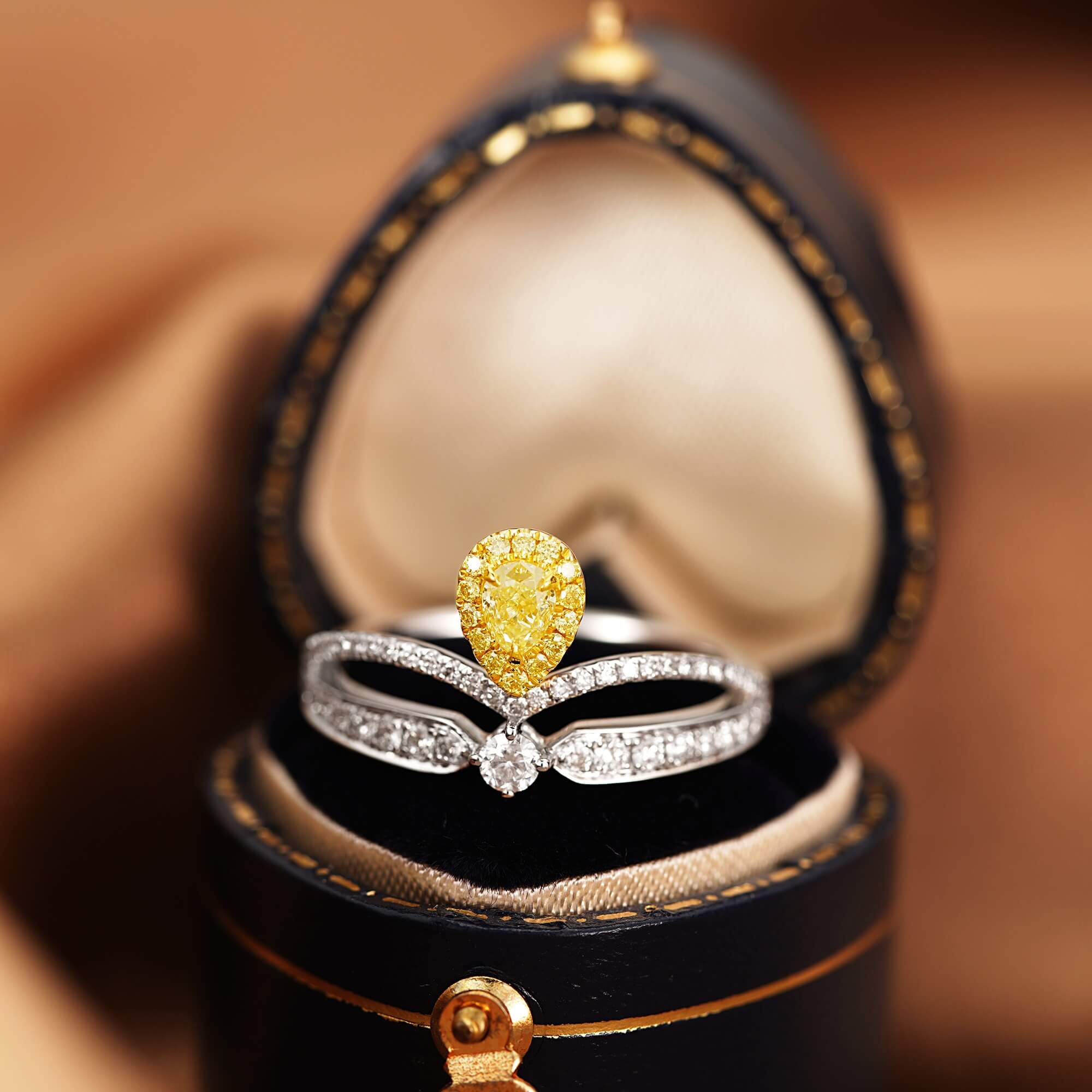 Halo setting pear cut lab grown yellow diamond engagement ring
