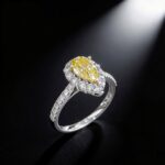 Halo setting pear cut lab grown yellow diamond engagement ring