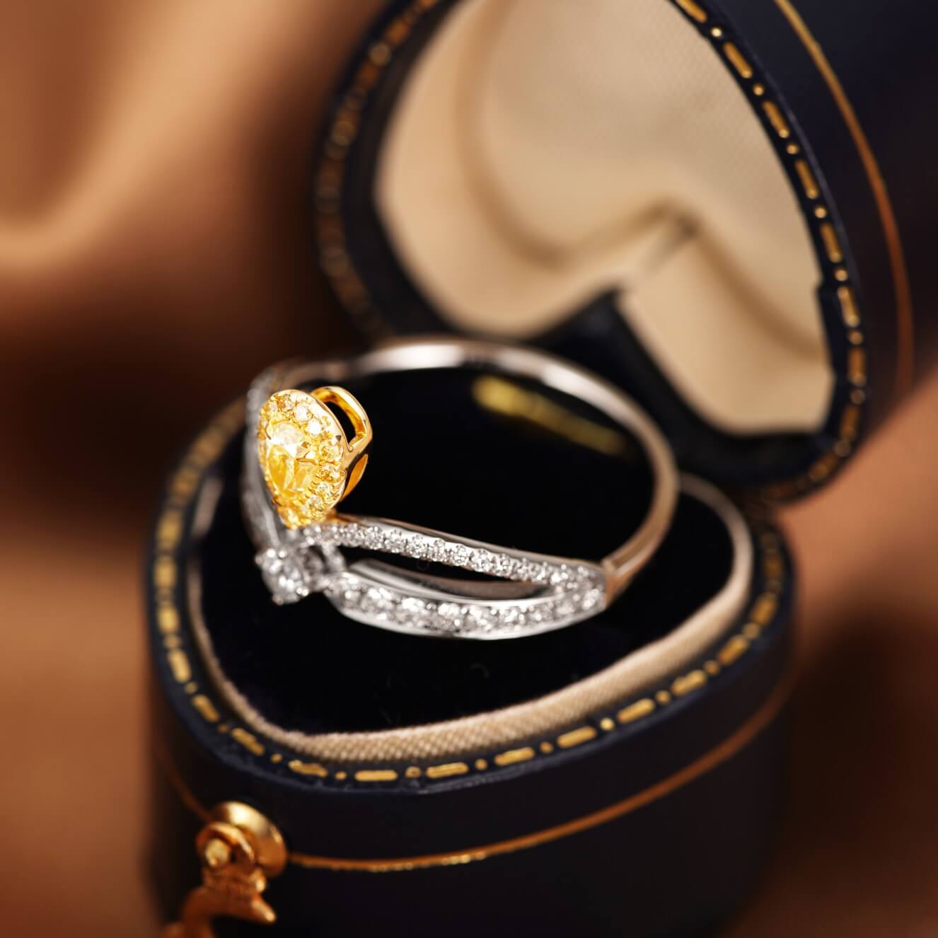 Halo setting pear cut lab grown yellow diamond engagement ring
