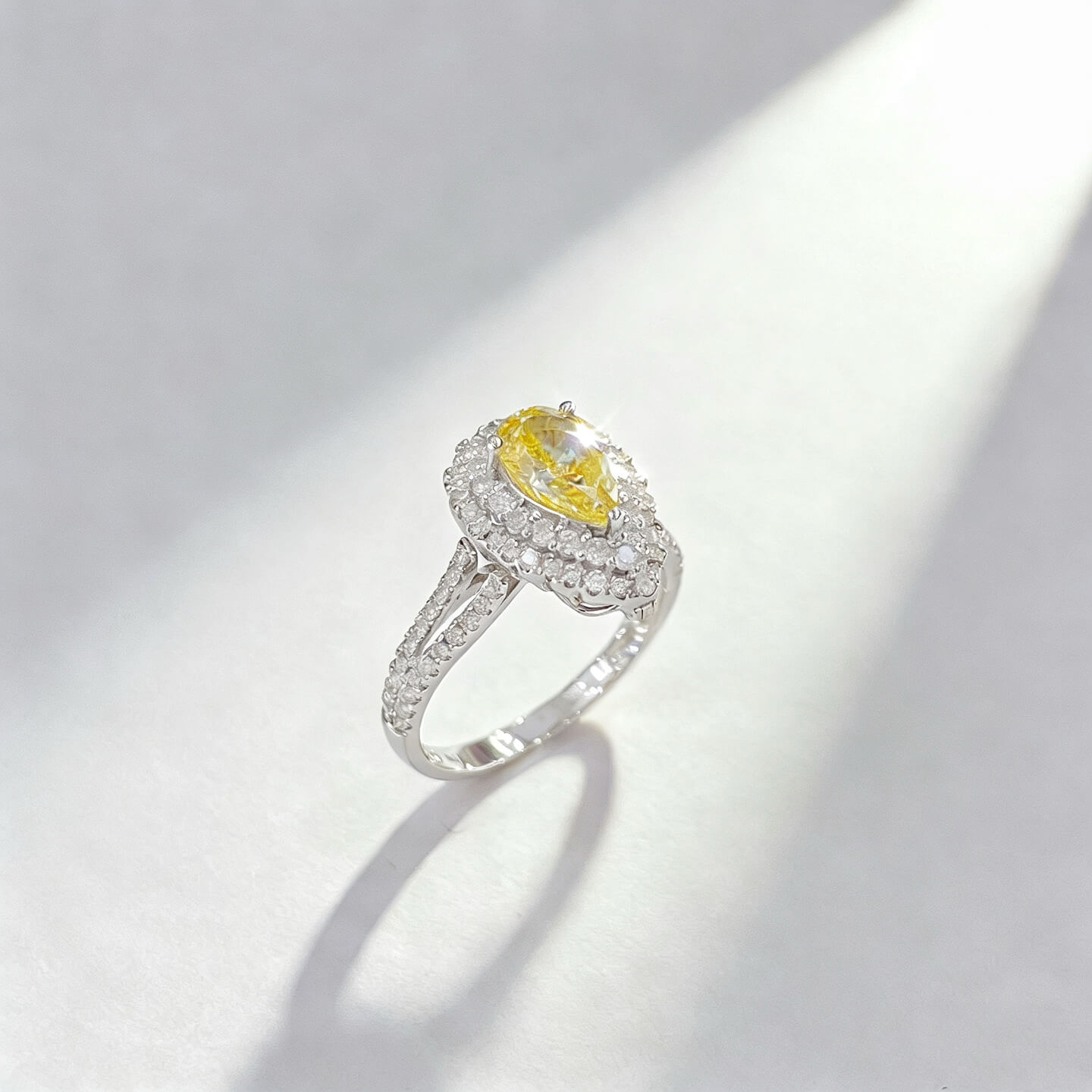 Halo setting pear cut lab grown yellow diamond engagement ring Halo setting pear cut lab grown yellow diamond engagement ring