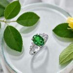 Oval cut lab grown emerald engagement ring