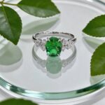 Oval cut lab grown emerald engagement ring