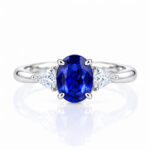 Oval cut lab grown sapphire three stones engagement ring