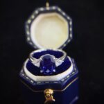 Oval cut lab grown sapphire three stones engagement ring