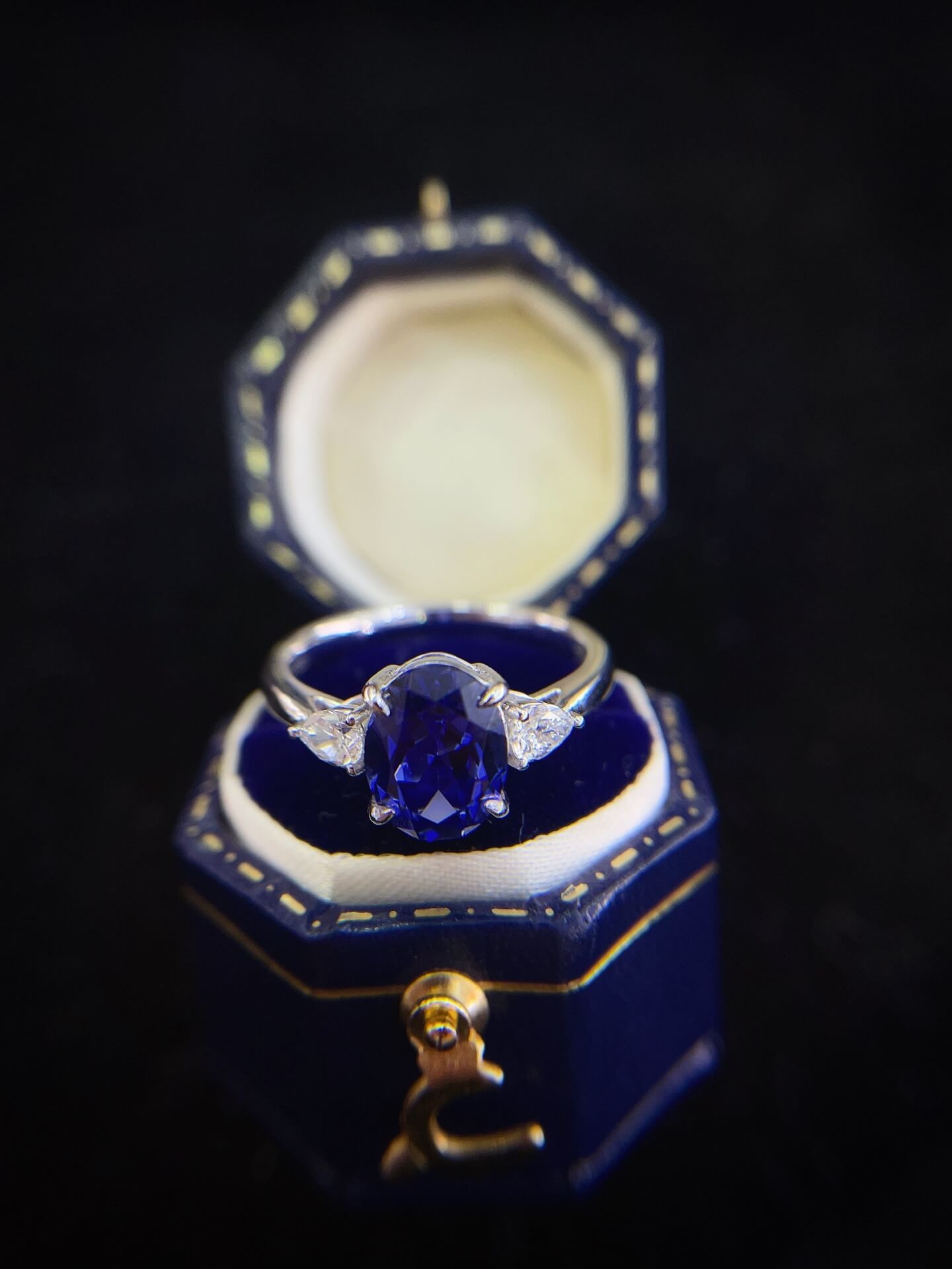Oval cut lab grown sapphire three stones engagement ring