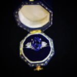 Oval cut lab grown sapphire three stones engagement ring