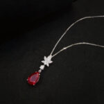 Pear cut lab grown ruby pendant necklace