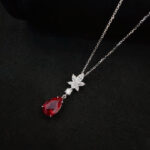 Pear cut lab grown ruby pendant necklace