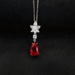 Pear cut lab grown ruby pendant necklace