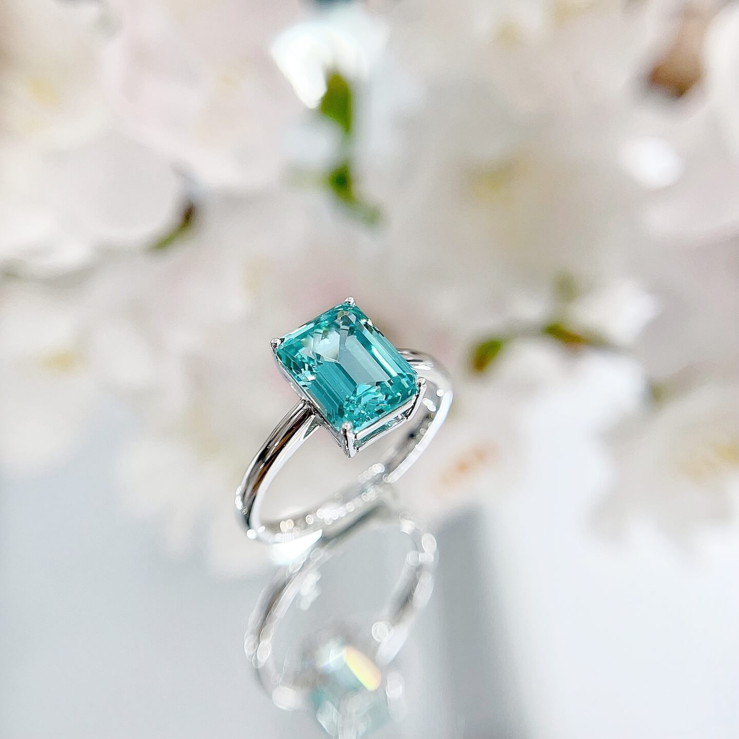 Radiant cut lab grown Paraiba engagement ring