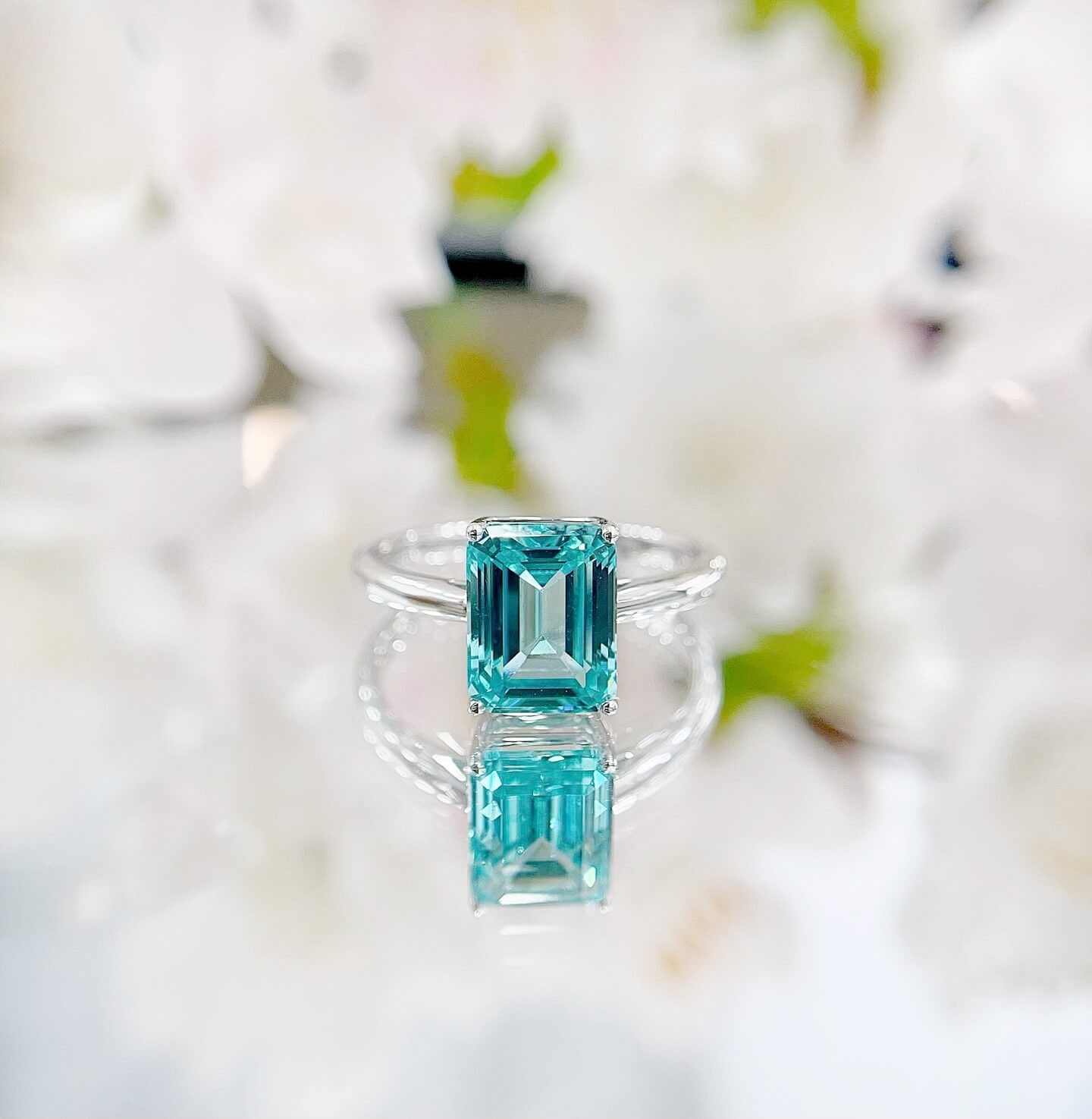 Radiant cut lab grown Paraiba engagement ring