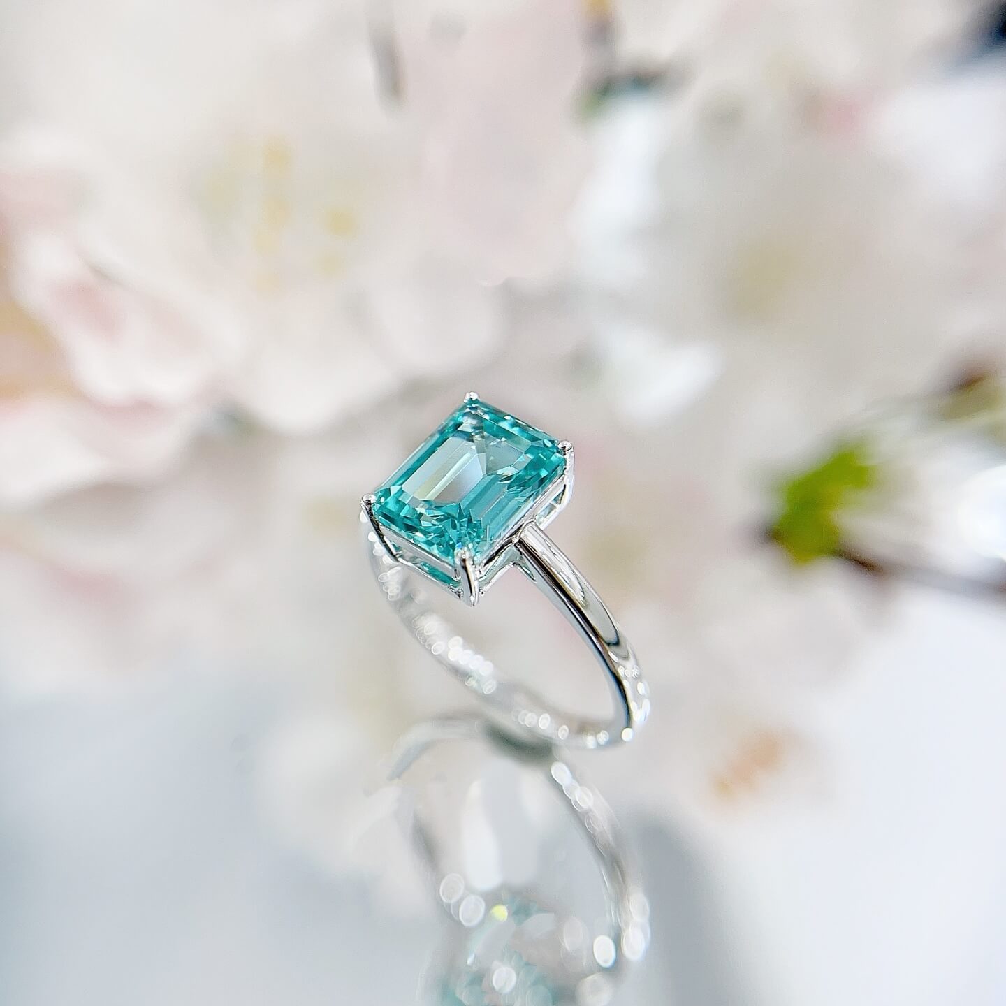 Radiant cut lab grown Paraiba engagement ring